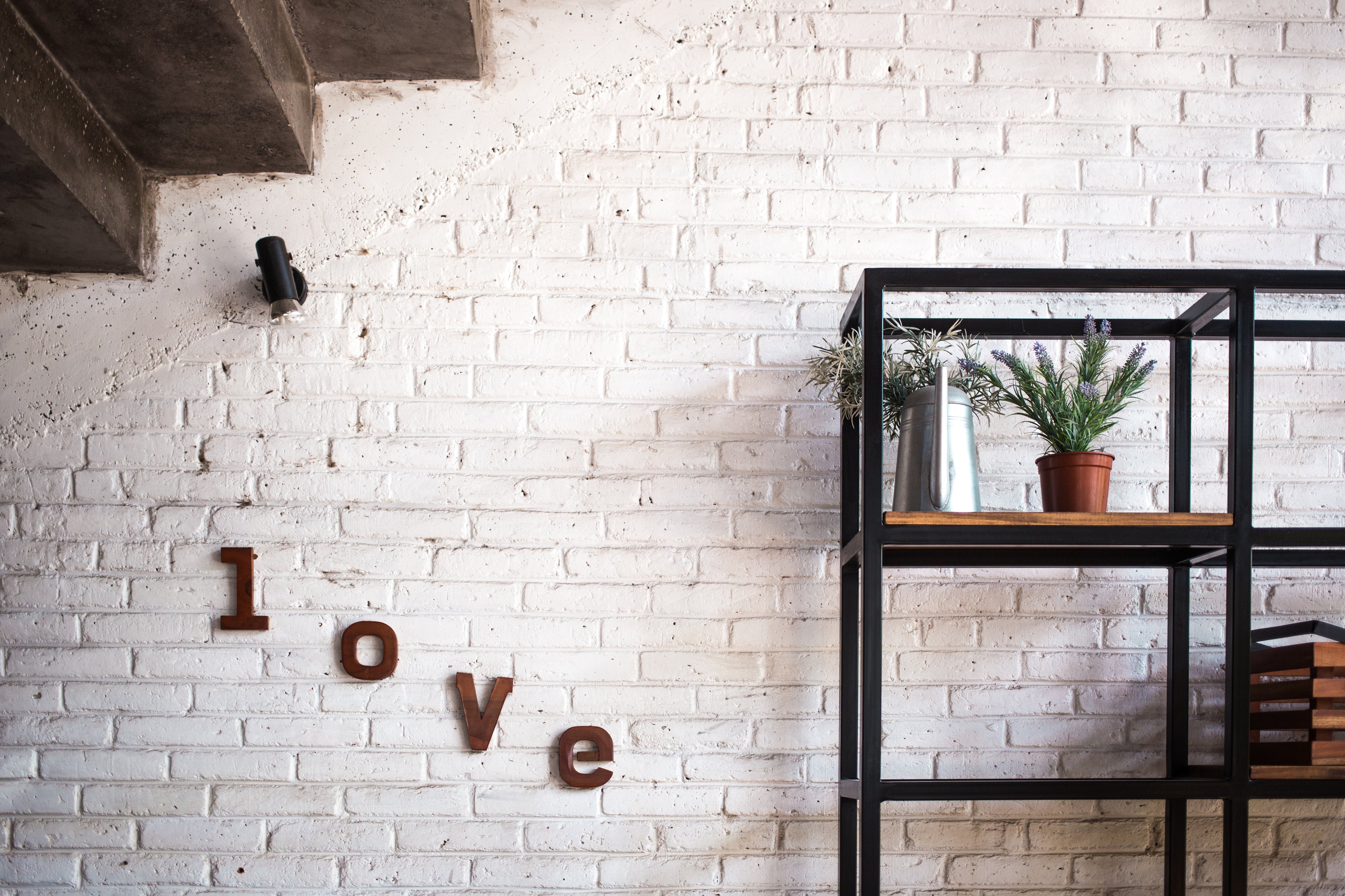 Antique Brass Letters LOVE on a Wall